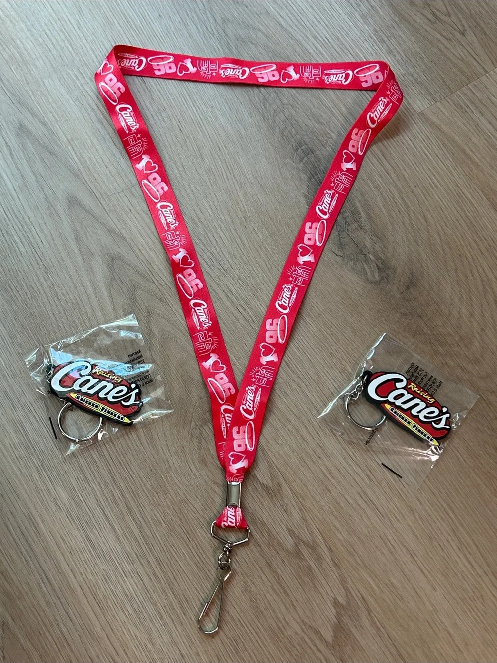 Raising Cane's Red Logo Lanyard with 2 Raising Cane’s Keychains bundle NEW